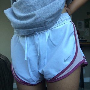 Pink and white nike running shorts